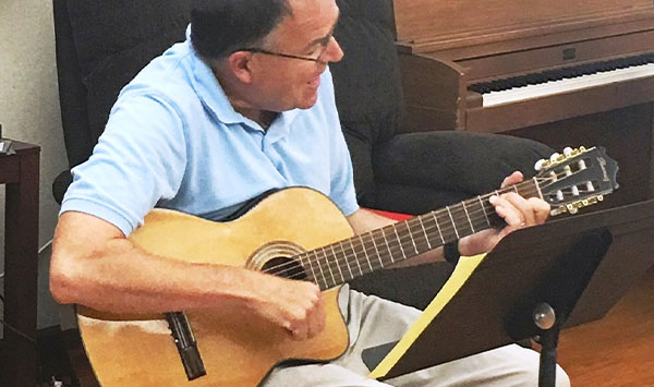Retired Mason teacher Doug Parrot brings joy and smiles to Christian Village at Mason residents through his music.