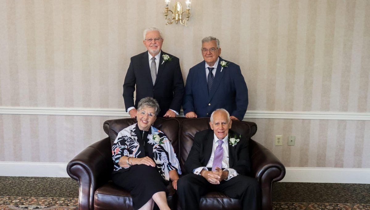 honorees posed around a couch