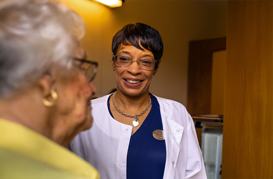 Senior woman and nurse having a conversation