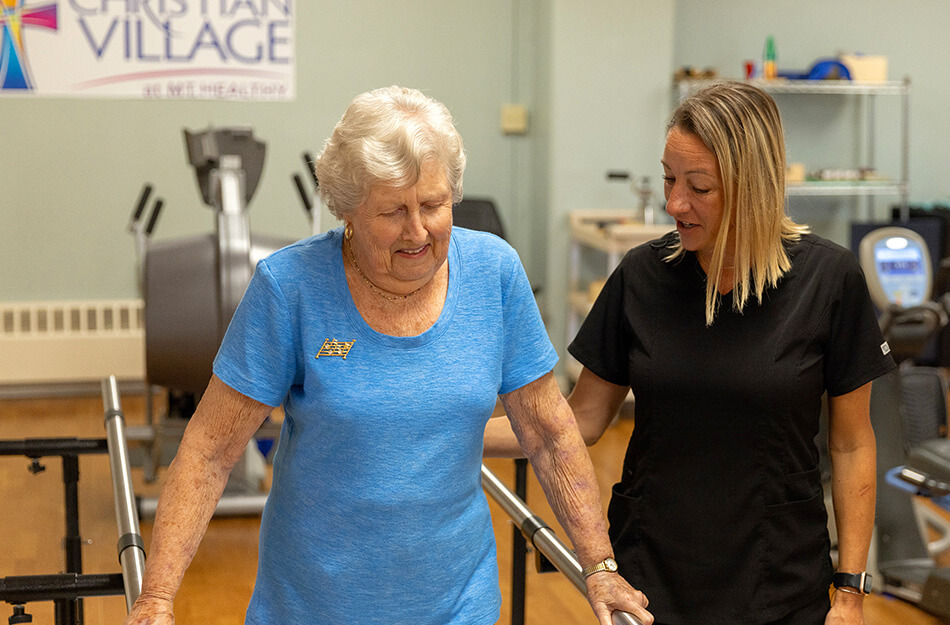 Senior woman doing physical therapy with a professional