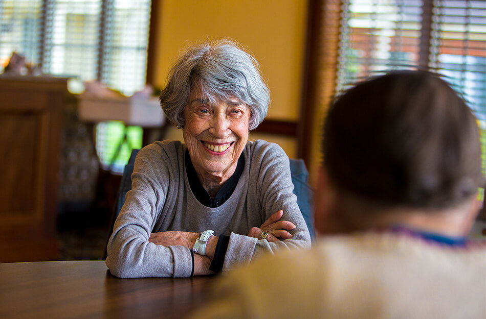 Senior woman sitting and smiling
