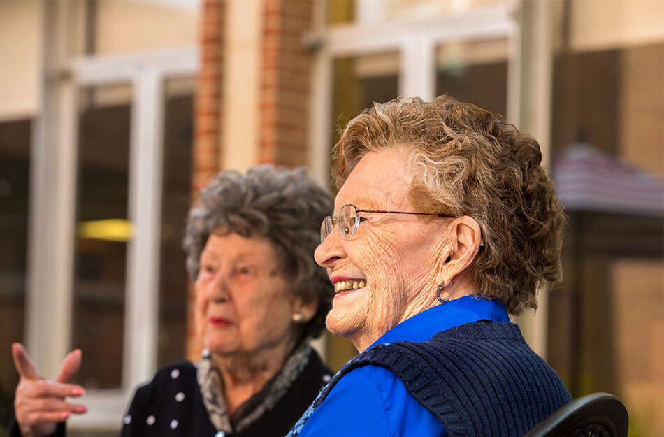 Senior women sitting talking to each other