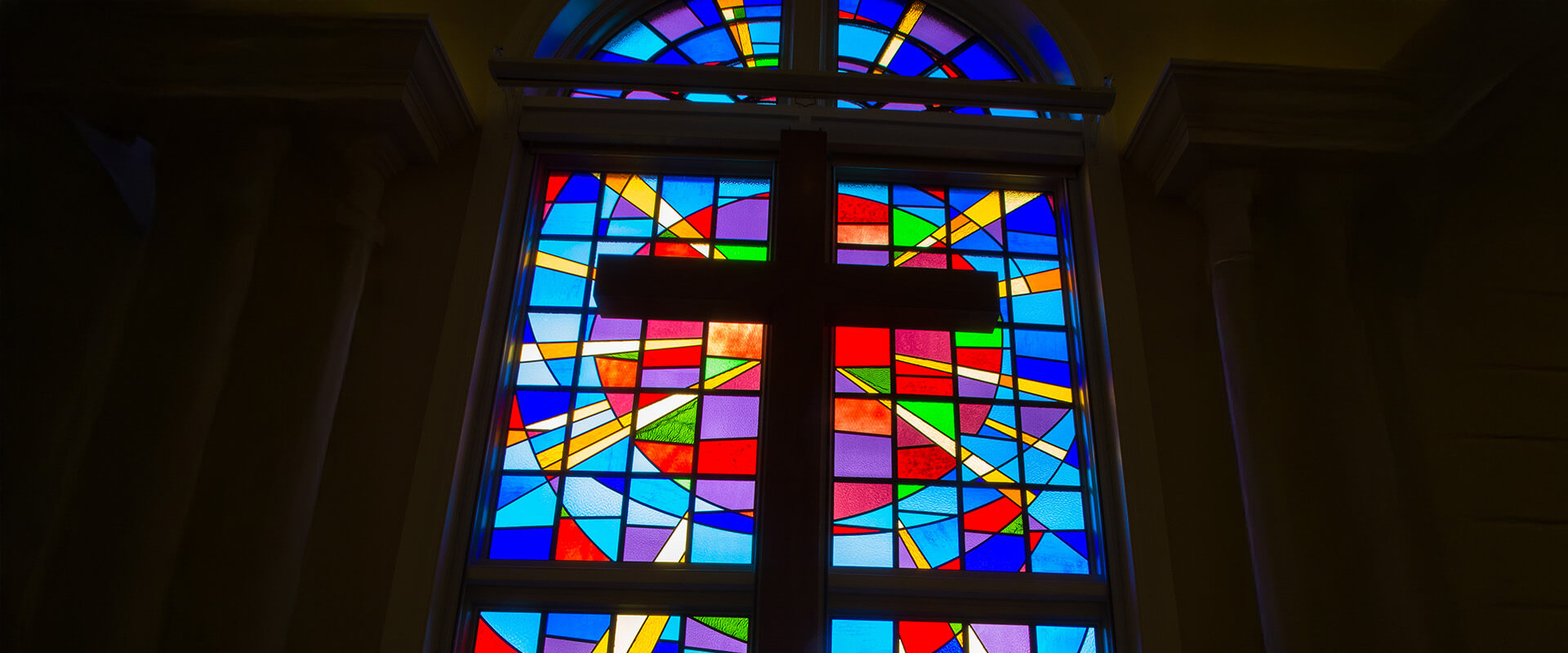 Cross over bright stain glass