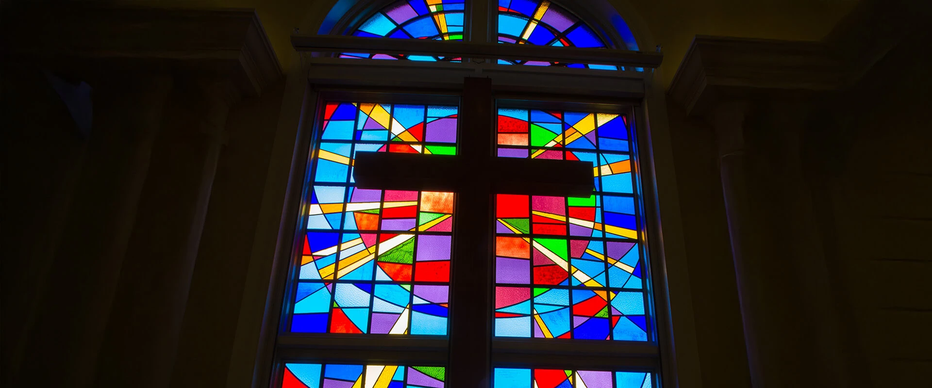 Cross over bright stain glass