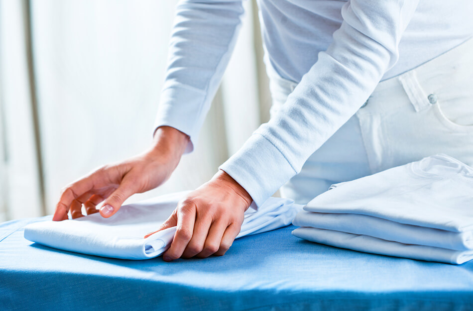 Woman folding linen