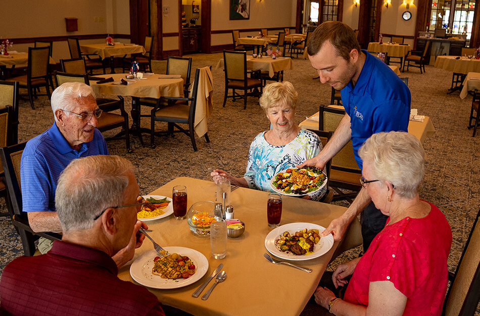 Friends being served dinner