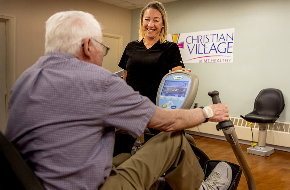 Senior man working out with help of a physical therapist
