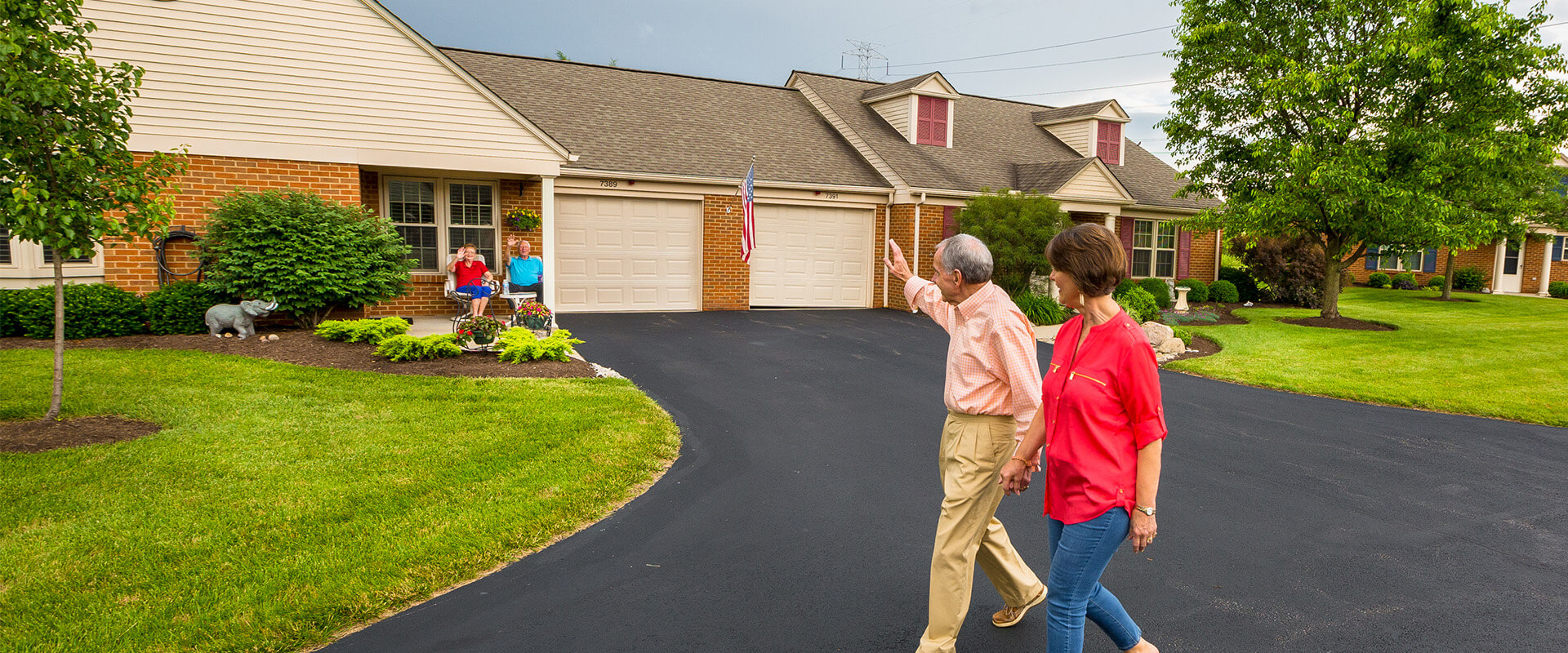 Neighbors wave during their walk