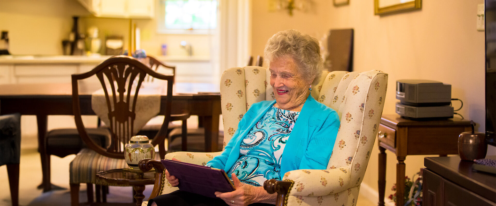 Senior woman reading in her home