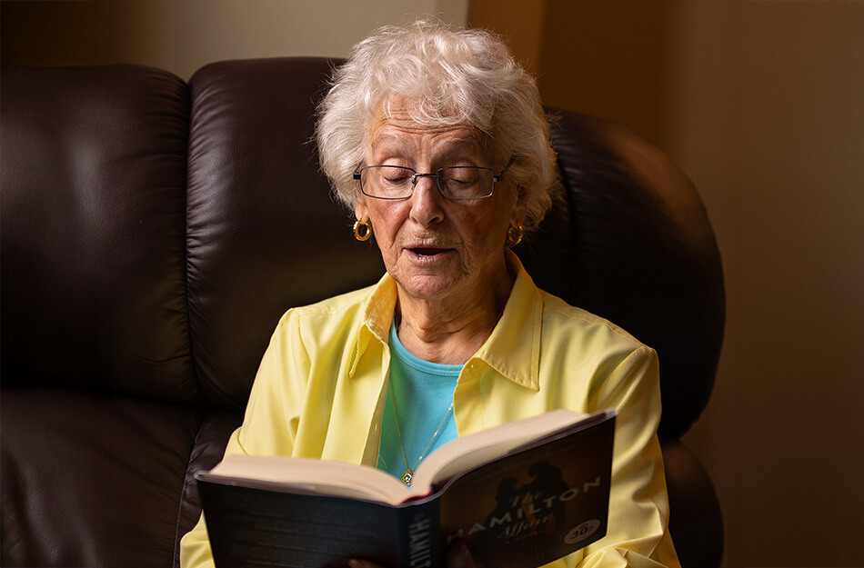 Senior woman reads out loud