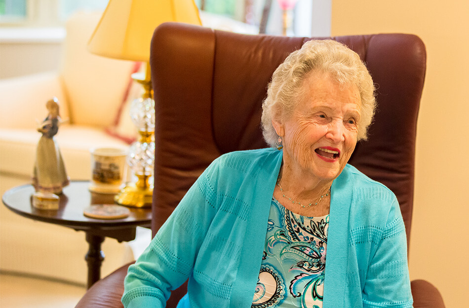 Senior woman sitting in a comfortable