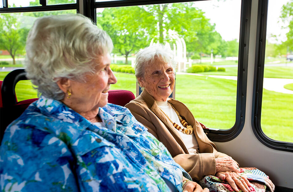 Seniors enjoying a bus ride together