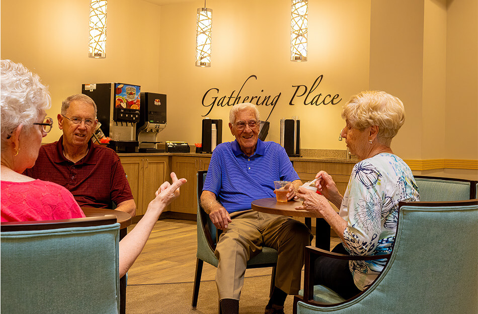 Seniors sitting in a cafe and talking