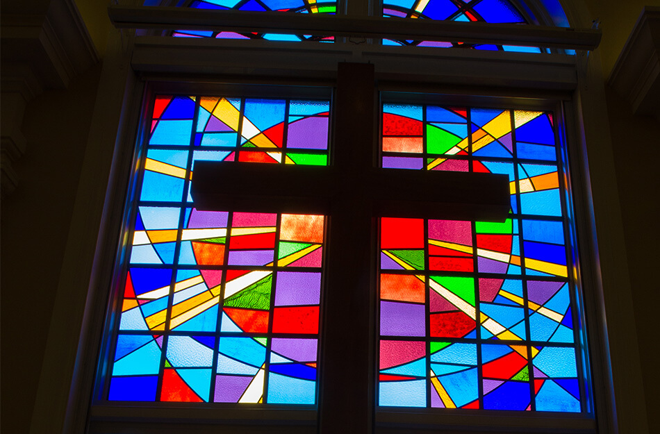 Close up of a stain glass cross