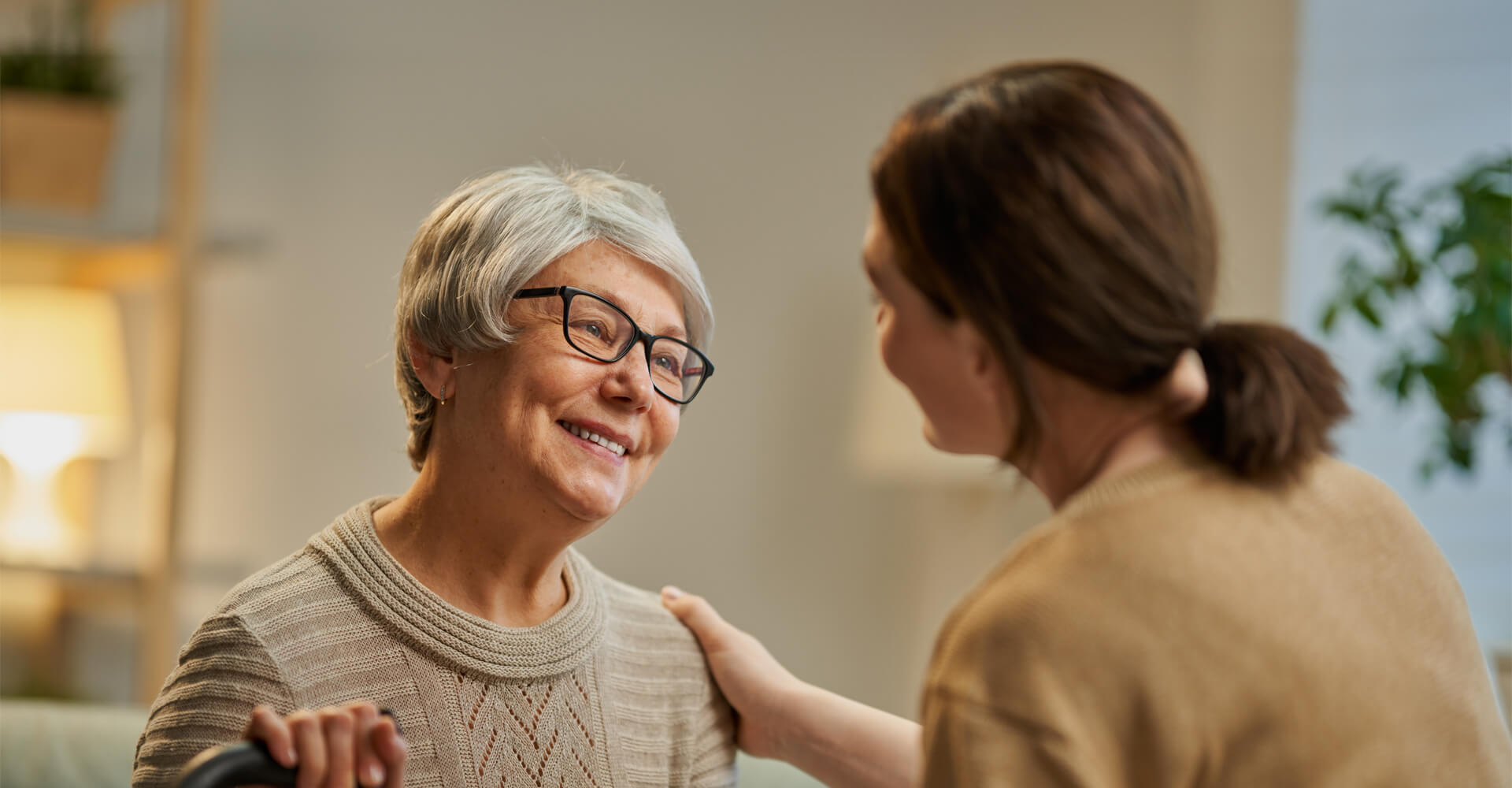 Senior woman with adult daughter.