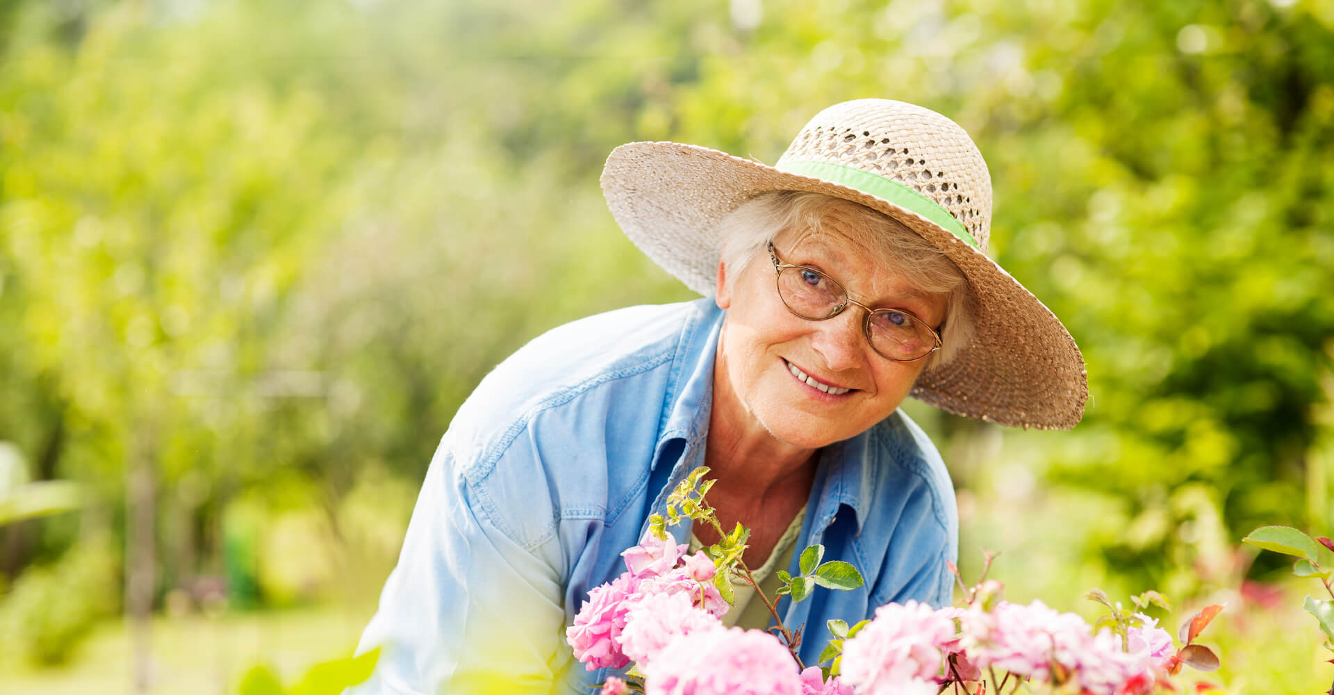 Senior woman gardening pretty flowers.